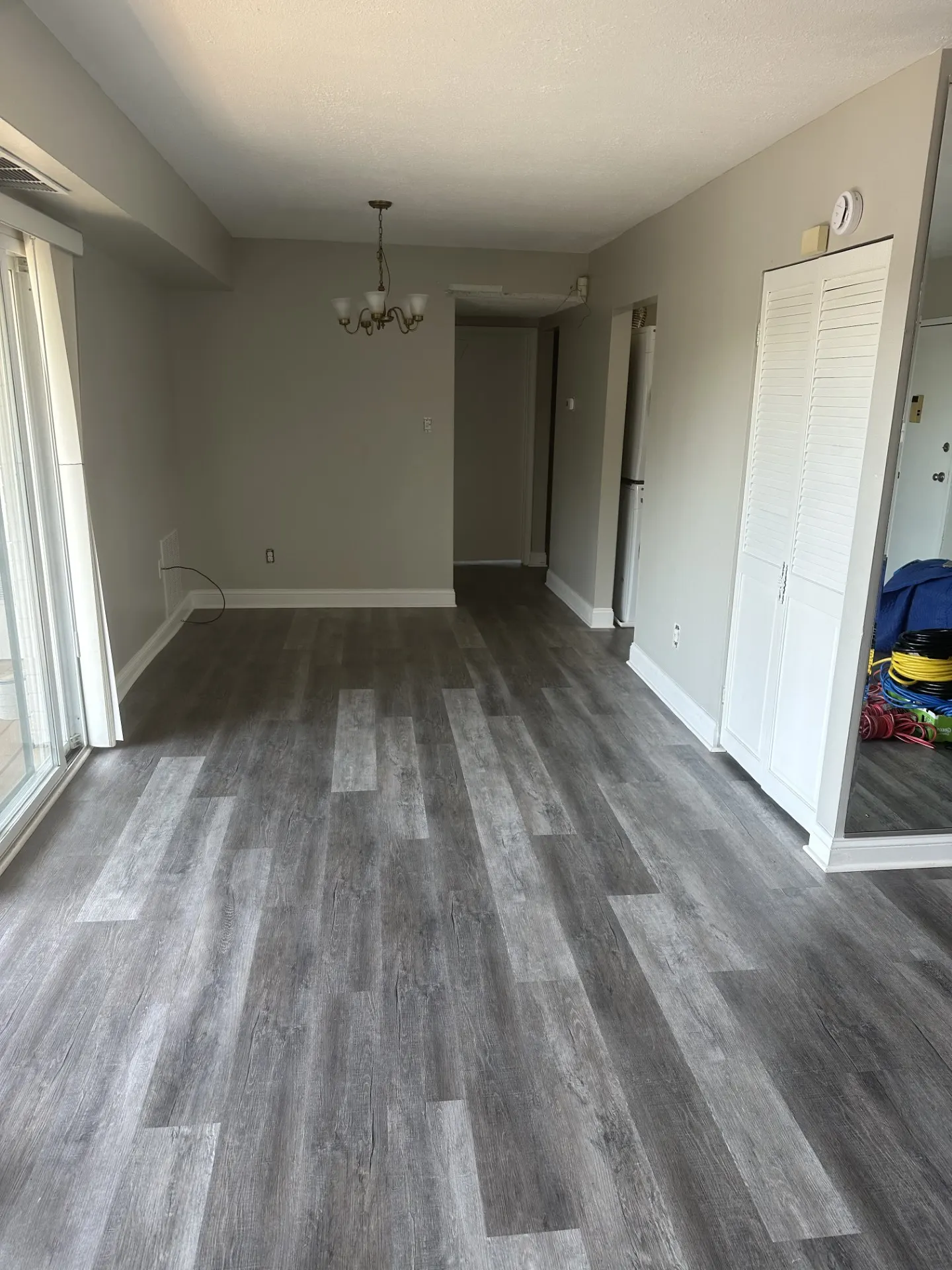 Open living and dining area with new flooring, ready to be furnished